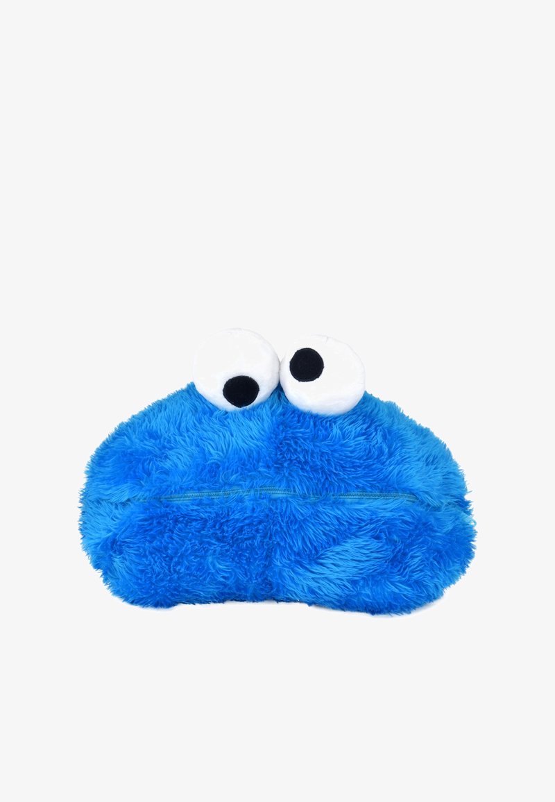 Bustina di peluche blu a forma di personaggio dei cartoni animati, con due grandi occhi bianchi, una texture morbida e pelosa e una chiusura con cerniera lungo la parte inferiore.