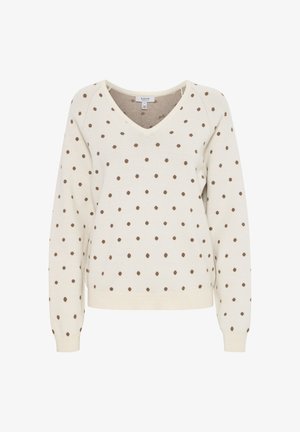 Kremowy sweter z dekoltem w kształcie litery V, z równomiernie rozmieszczonymi brązowymi kropkami, ściągacze na rękawach i na dole. Miękka dzianinowa tekstura.