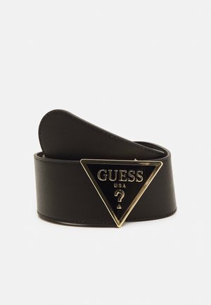Black leather belt with a gold-trimmed triangular buckle featuring "GUESS USA" and a question mark symbol.
