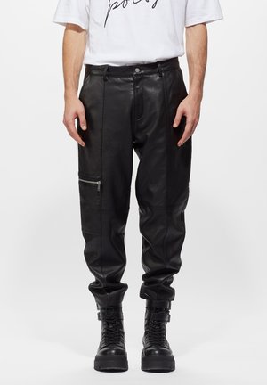 TONI SOFT - Trousers - black