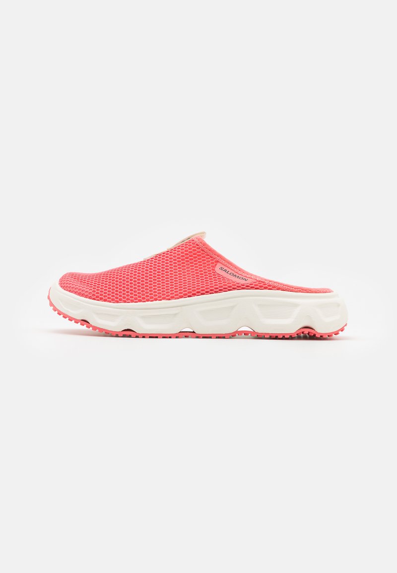 Red mesh slip-on shoes with a white midsole and textured rubber outsole, featuring a rounded toe and minimalistic design.