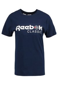 Námořnická modrá bavlněná tričko s krátkým rukávem, na kterém je na hrudi bílé a červené logo "Reebok CLASSIC". Design s kulatým výstřihem.