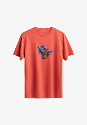 Red cotton t-shirt with short sleeves, featuring a blue bird graphic in the center on a branch, with a crew neck and relaxed fit.