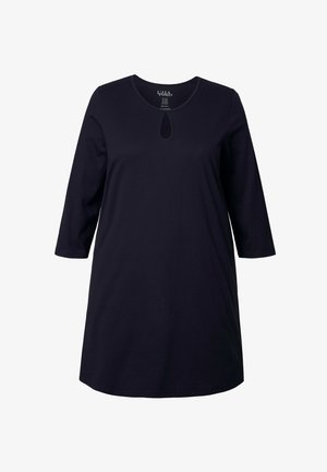Tunique bleu marine à manches trois-quarts en coton doux. Présente un décolleté rond avec un petit détail en forme de découpe en clé.