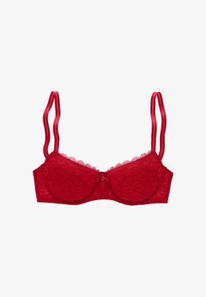 Red lace bra with molded cups, scalloped edges, and adjustable satin straps. Center bow detail adds a decorative accent.