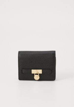 Black leather wallet with a textured finish, featuring a gold-tone clasp and hardware, and a rectangular shape with a minimalistic design.