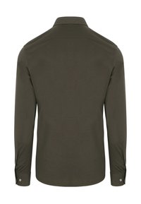 Langsleeve shirt in donkergroen, gemaakt van katoen. Beschikt over een klassieke kraag, knoopmanchetten en een gladde textuur, zonder zichtbare patronen.
