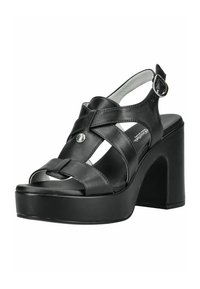 Sandale plateforme femme en cuir noir avec talon haut épais, brides croisées, bout ouvert et boucle de cheville ajustable.