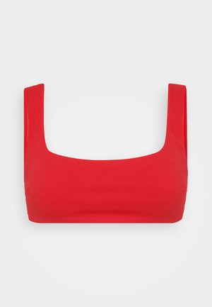 Red stretch crop top with a square neckline, wide straps, and a smooth, fitted design. Made from soft material with a lightweight texture.