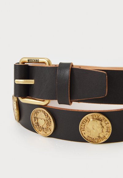 Black leather belt with gold metal accents, featuring decorative coins. Contains a gold-tone buckle and a distinct logo detail.