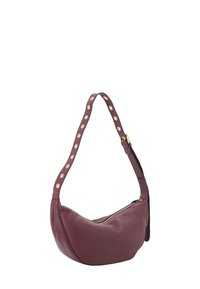 Sling bag in deep burgundy leather with a curved shape, gold-tone hardware, and a studded strap. Zippered closure on the side.