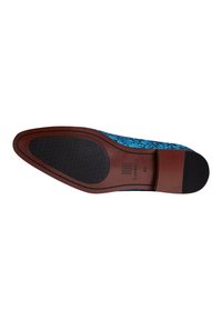 Blue patterned fabric shoe sole with a brown leather heel. Textured black rubber traction surface and label indicating size 43.