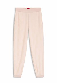 Lichtroze joggingbroek met een gestructureerd patroon en een elastische tailleband. Boorden bij de enkels en een klein rood label aan de achterkant van de tailleband.