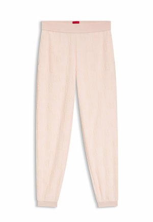 Ljusa rosa mjukisbyxor med ett strukturerat mönster och elastisk midjeresår. Muddar vid anklarna och en liten röd etikett på baksidan av midjeresåren.