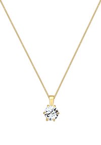 Collier en chaîne dorée présentant un pendentif en cristal transparent rond avec six griffes, exhibant une texture lisse et une surface réfléchissante.