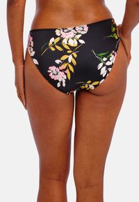 Černé bikini spodní část s květinovým vzorem v růžových, bílých a žlutých květech, vyrobené z hladkého materiálu s nízkým střihem a bezšvovými okraji.