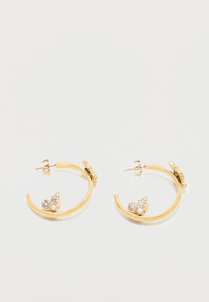 Gold hoop earrings with small leaf-shaped decorations adorned with pearls and crystals near the base, displayed on a white background.