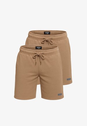 Shorts de sport beiges en tissu doux, avec une taille élastique à cordon de serrage, des poches latérales et des accents de marque.