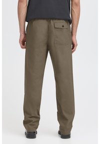 Khaki pants made of cotton blend, featuring a back pocket with a button, relaxed fit, and straight-leg design.