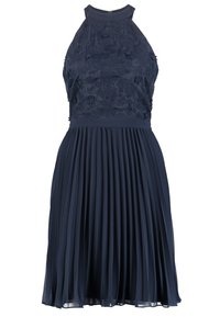 Navy blue dress with a pleated skirt and a textured embroidered bodice. Sleeveless design, high neckline, and slim waistline.