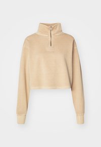Geknipte beige sweatshirt met een hoge kraag en een halve rits. Heeft lange mouwen en een klein reliëflogo aan de voorkant.
