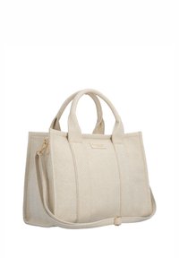 Sac cabas en tissu beige texturé avec deux poignées et une bandoulière réglable sur fond blanc.
