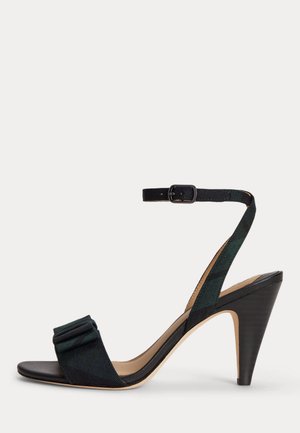 Sandalette noire à talon haut avec bride à la cheville et boucle, bout ouvert et détail nœud en tissu sur la bride avant.