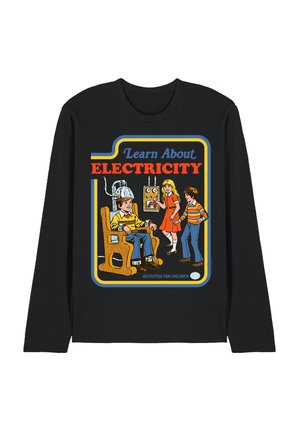 Children engaging with a vintage electricity experiment: boy sits in wooden chair with helmet, girl flips switch, and boy watches.