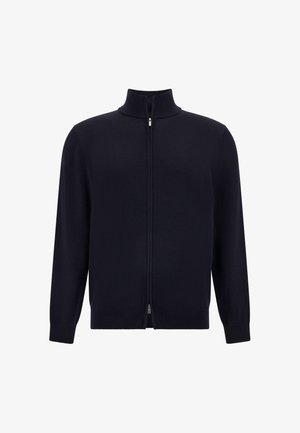 Granatowy sweter na zamek z wysokim kołnierzem, długimi rękawami, prążkowanymi mankietami i dolnym brzegiem; wykonany z gładkiego, miękkiego materiału, z dyskretnym zamkiem błyskawicznym.