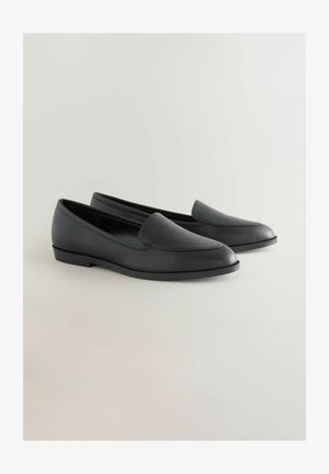 Black leather loafers with a smooth texture, tapered toe, and minimalistic design. Flat rubber soles with subtle stitching accents.