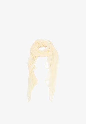 Pañuelo transparente de color crema claro, anudado suelto con extremos largos y fluidos sobre un fondo blanco sencillo.