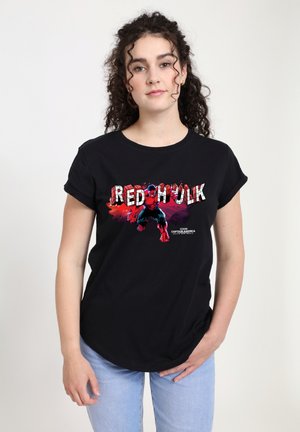 Schwarzes Baumwoll-T-Shirt mit einem bunten "RED HULK" Grafikdesign. Kurze Ärmeln und einem runden Ausschnitt. Akzente in Rot- und Blautönen.