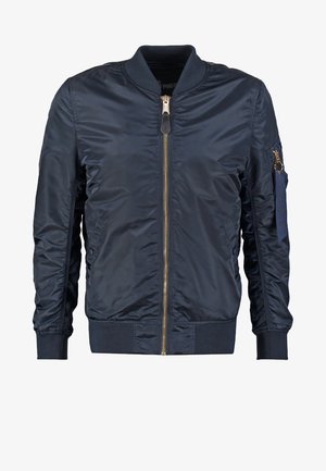 Námořnická modrá bomber bunda vyrobená z hladkého syntetického materiálu, s předním zipem, ribovanými manžetami a kapsou na rukávu se zipem.