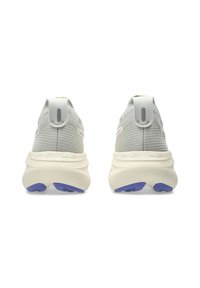 Light gray athletic shoes with a textured upper, rounded shape, cream midsole, and purple rubber accents on the outsole.