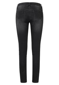 Schwarze Jeggings mit einer figurbetonten Silhouette, aus dehnbarem Denim. Verfügt über zwei Gesäßtaschen und einen Bund mit Gürtelschlaufen.