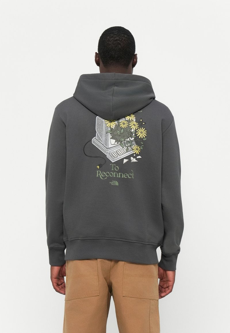 Gray hoodie featuring a graphic of a computer surrounded by flowers, text saying "To Reconnect," and ribbed cuffs at the hem.