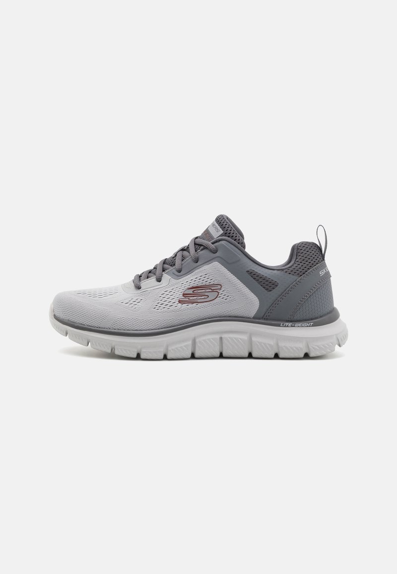 Light gray athletic shoes with a breathable mesh upper, textured gray accents, laces, and a cushioned white sole. Features logo on side.