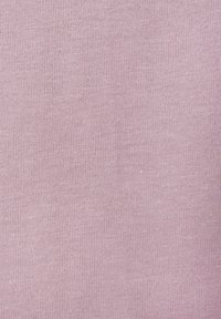 Light pink knit fabric with a smooth texture, displaying a uniform weave pattern. No notable hardware or accents present.
