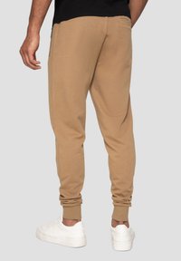Threadbare JOGGER THBMICKEY - Trainingsbroek - stone
