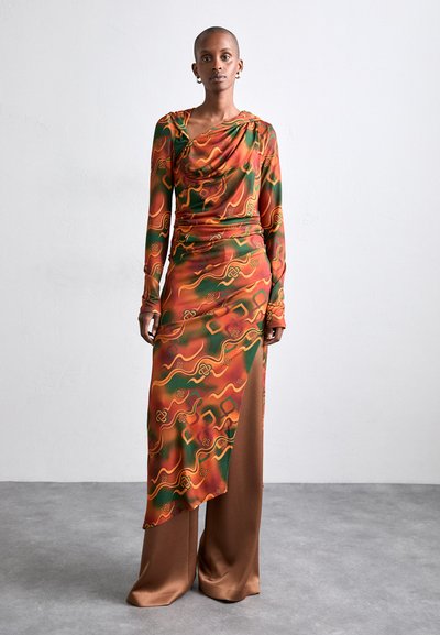 Long, colorful dress with swirling green, orange, and yellow patterns; features a draped neckline and a thigh-high side slit.