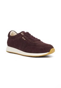Suede athletic shoe in dark burgundy with lace-up closure, white midsole, and gum rubber outsole; features minimal branding on the side.
