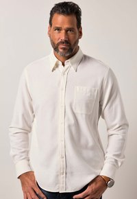 Witte overhemd met lange mouwen, knoopsluiting, met een borstzak, gemaakt van gestructureerde stof. Gestyled met een subtiele kraag en manchetaccenten.