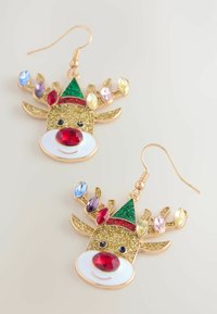 Gold-tone reindeer earrings featuring glittery details, red and colorful gemstones, a green and red hat, and a white enamel nose.