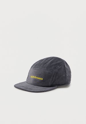 Dark gray corduroy cap with a short brim and yellow "Peak Performance" logo embroidered on the front panel.