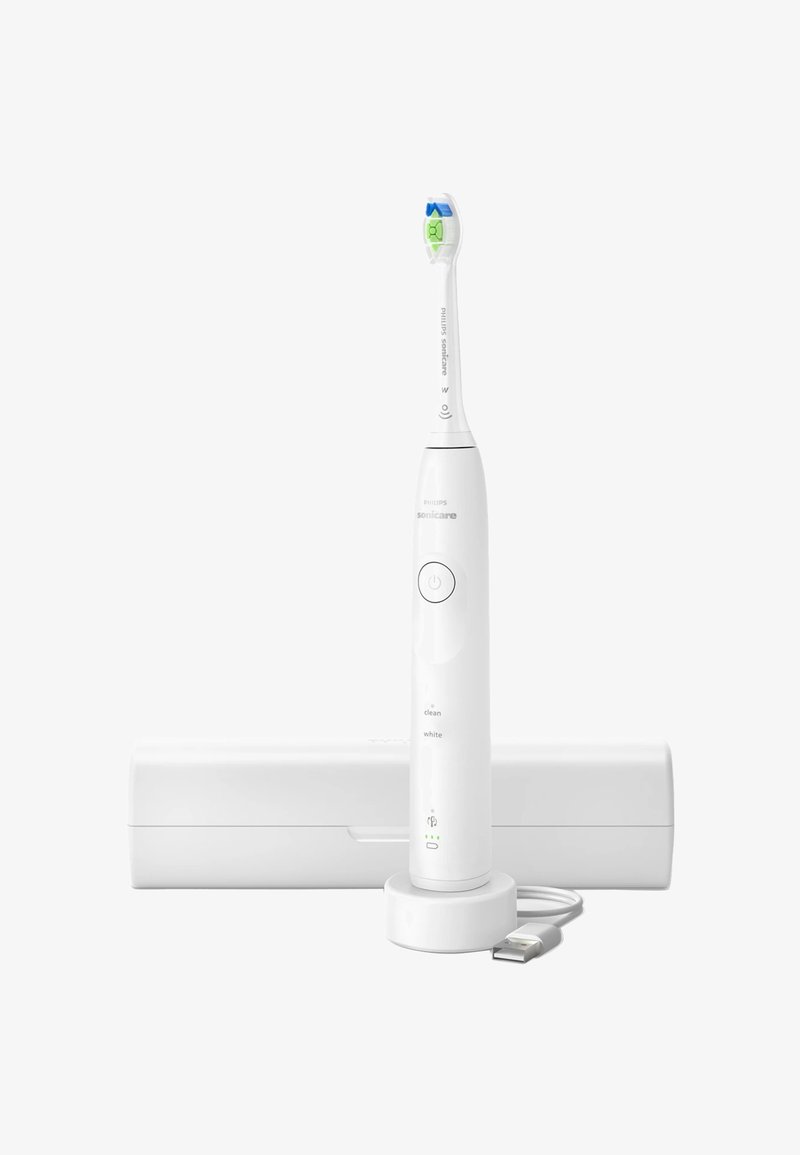 Brosse à dents électrique sonique blanche avec une tête de brosse bleu et vert, station de chargement et étui de voyage blanc. Câble USB inclus.