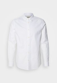 White long-sleeve button-up shirt made of cotton, featuring a structured collar, subtle logo embroidery, and light tan buttons.