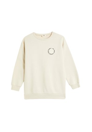 Sudadera de color crema hecha de una tela suave, con un diseño gráfico redondo en el pecho. Manga larga con puños y dobladillo acanalados.