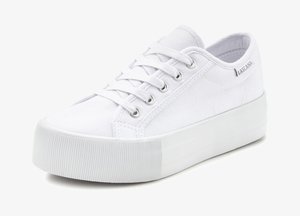 White canvas sneakers with flat laces, round toe, and raised rubber sole. Features metal eyelets and textured side accents.