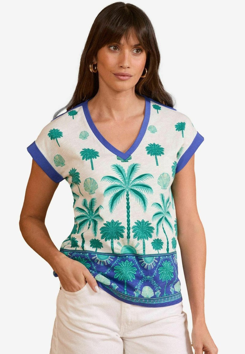 V veida kakla, īsām piedurknēm topiņš krēmkrāsā ar zaļu palmu un gliemežvāku druku. Ar zilu apdari un rakstainu apakšmalu. Izgatavots no mīksta auduma.