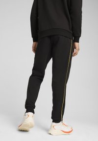 Puma MINIMAL GOLD JOGGING - Pantalones deportivos - black
